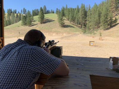 Man Shooting Rifle At Range